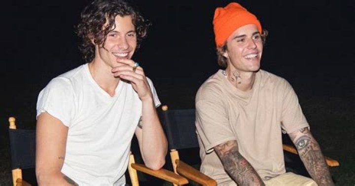 JUSTIN BIEBER COLLABS WITH "DUDE WITH SIGN" GUY Maven Buzz