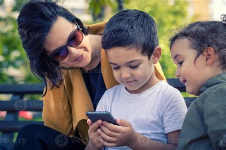 Kid with Mum Using Mobile Tablet Together Stock Image Image of sofa